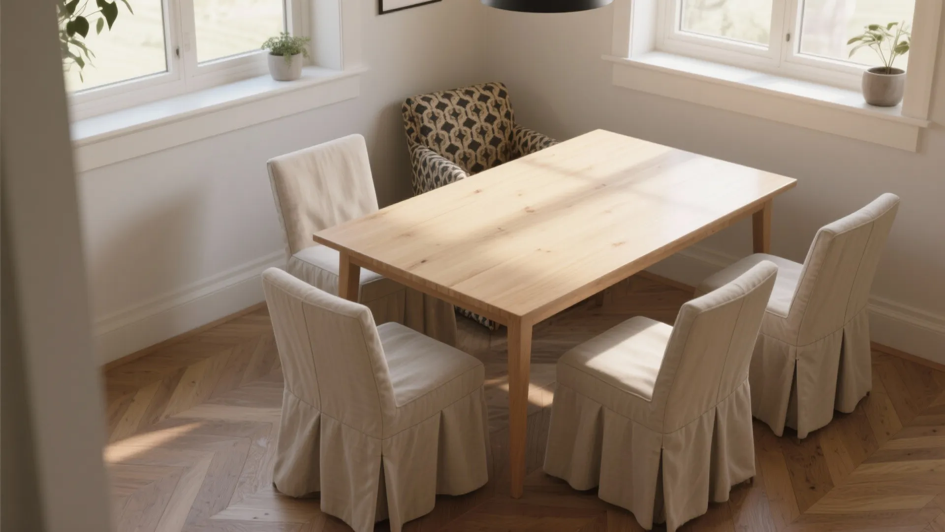 Wooden dining table surrounded by white chairs with long curtains in a bright modern room