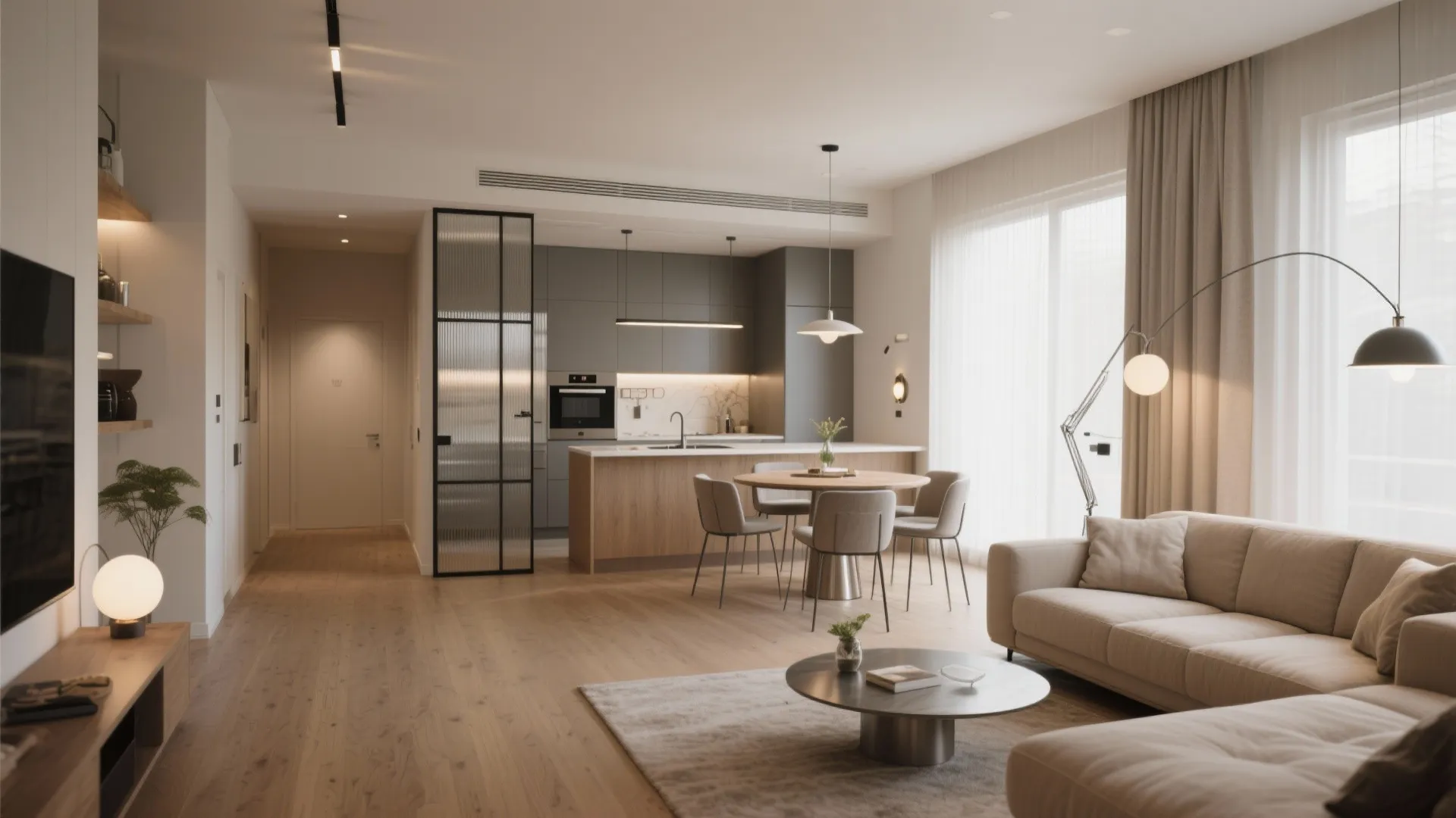 Modern open living area with wooden floor grey kitchen island round dining table and beige sofa