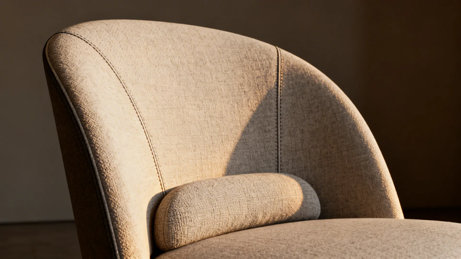 Close-up of compact accent chair showing subtle lumbar curve and textured upholstery