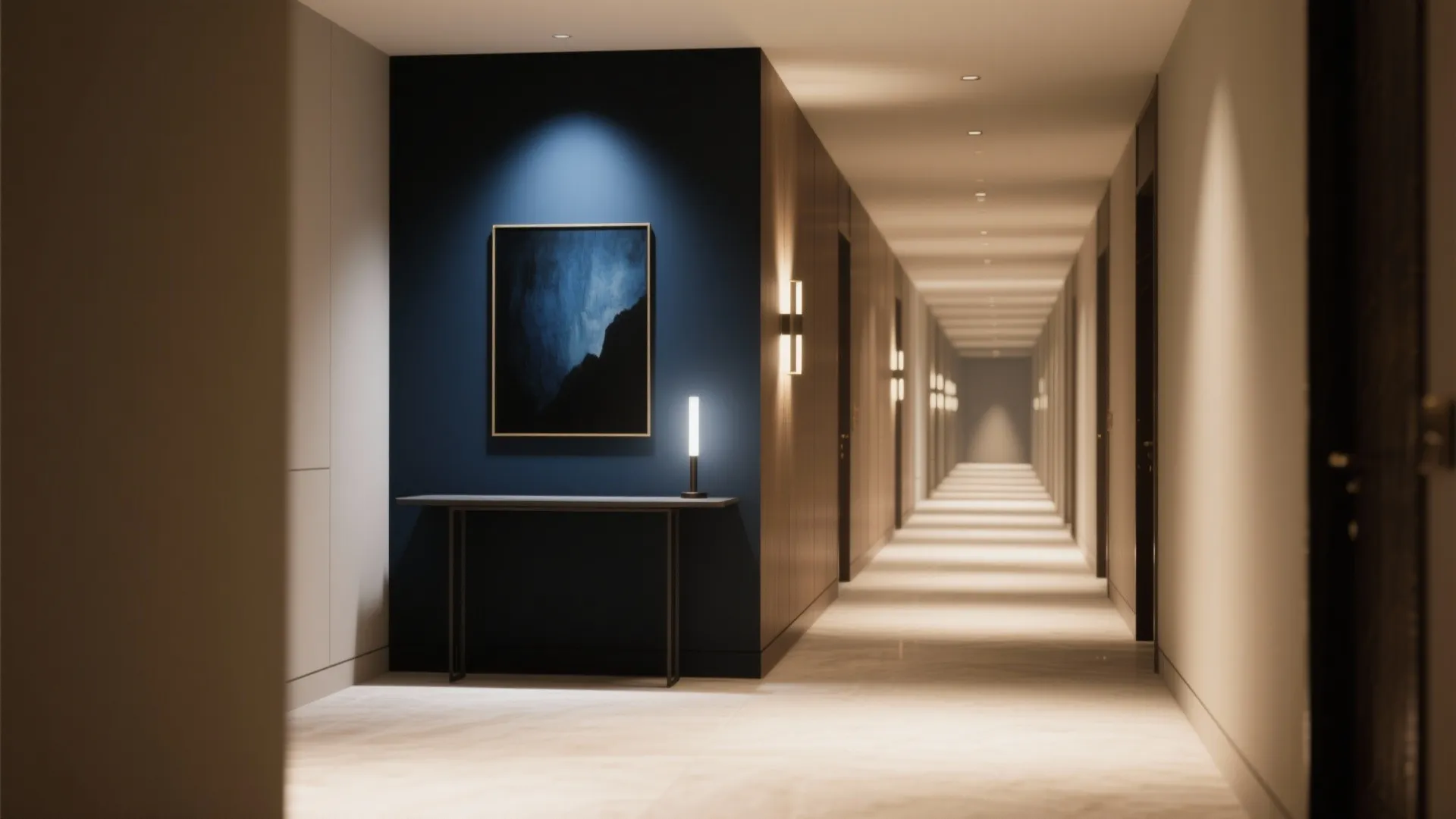 Long hallway with a dark accent end-wall featuring art and a slim console under a picture light.