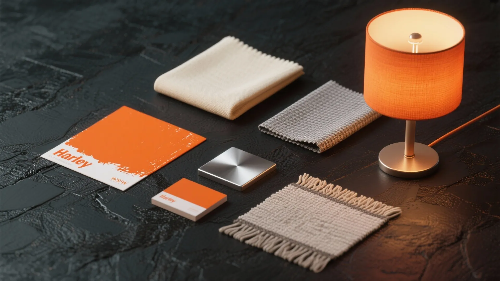 Flatlay of Harley-inspired accent colors: orange, cream, metallic silver and material swatches.