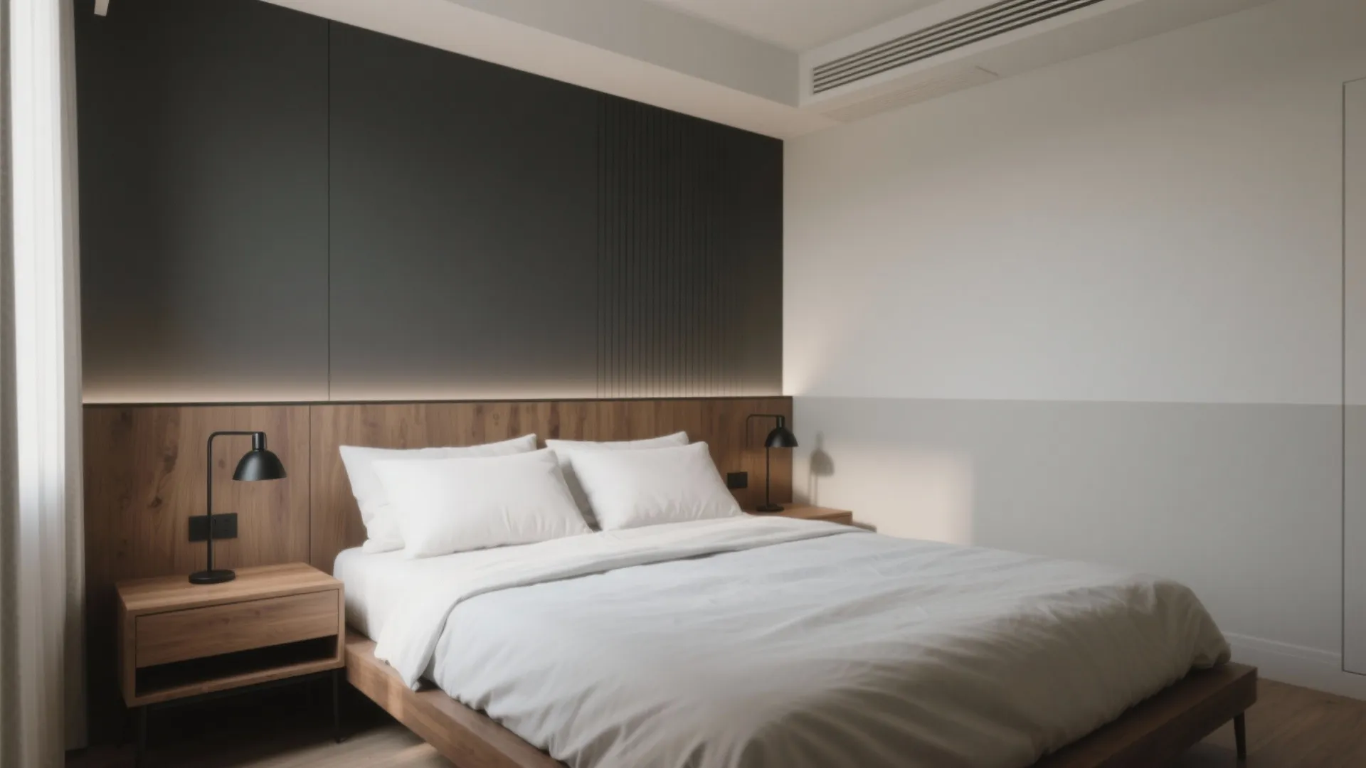 Modern bedroom with grey wall panel, wood headboard, white bedding, and two black table lamps