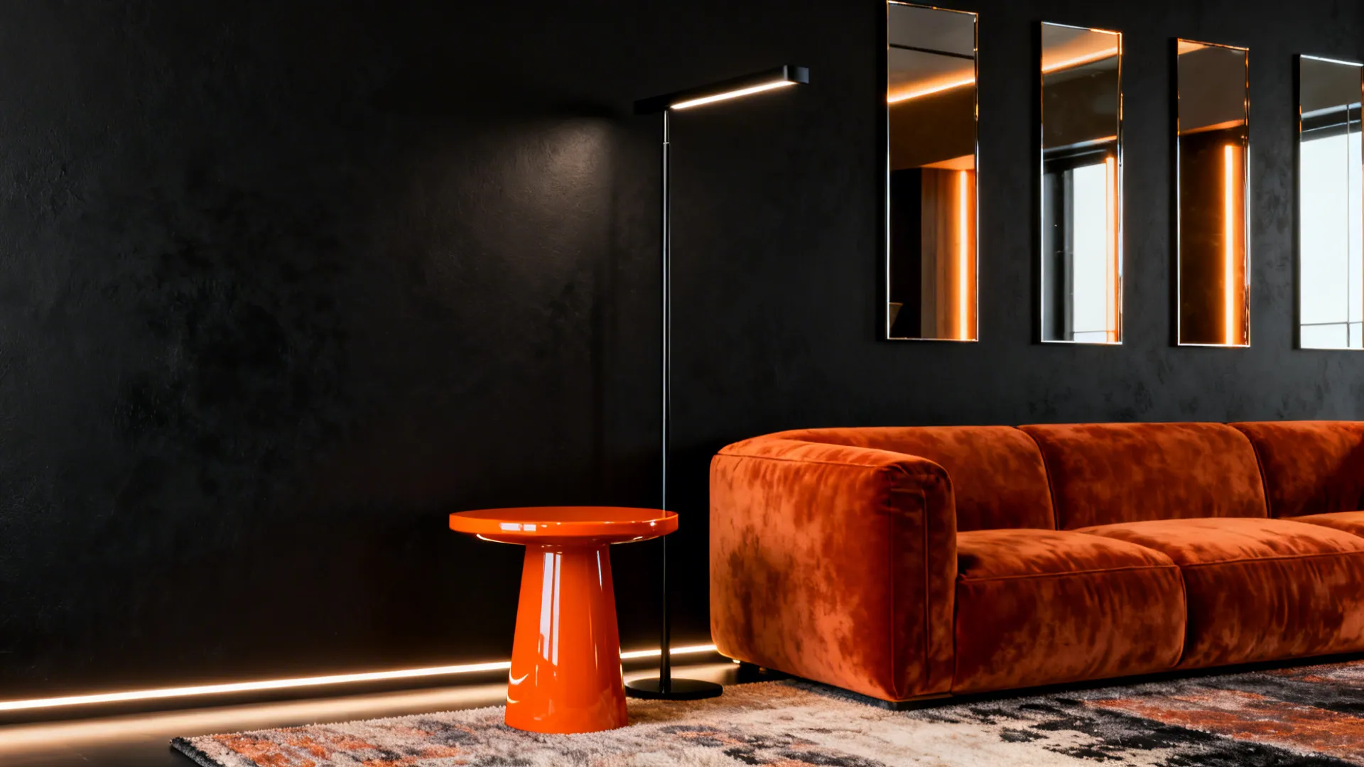 Accent matte-black wall with a burnt-orange velvet couch, glossy orange side table and layered lighting.