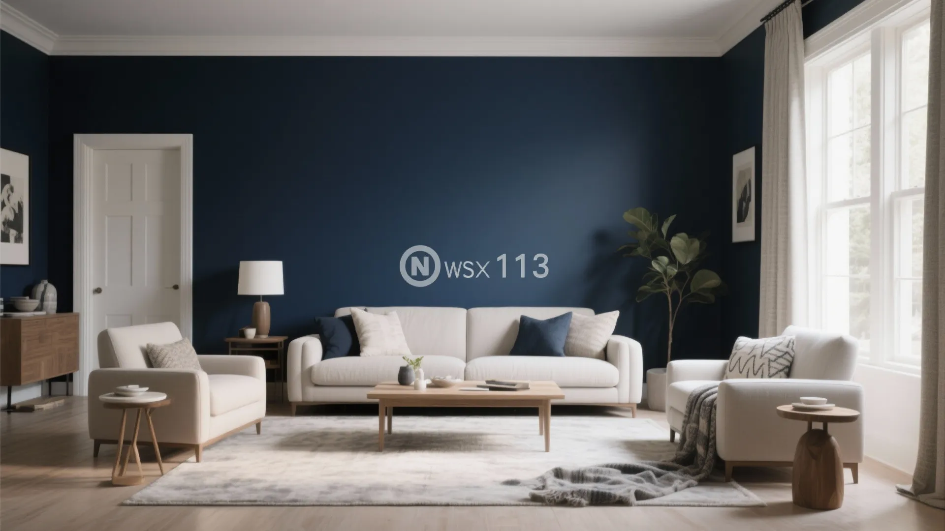 Modern living room featuring a navy blue accent wall with white sofa and wooden coffee table