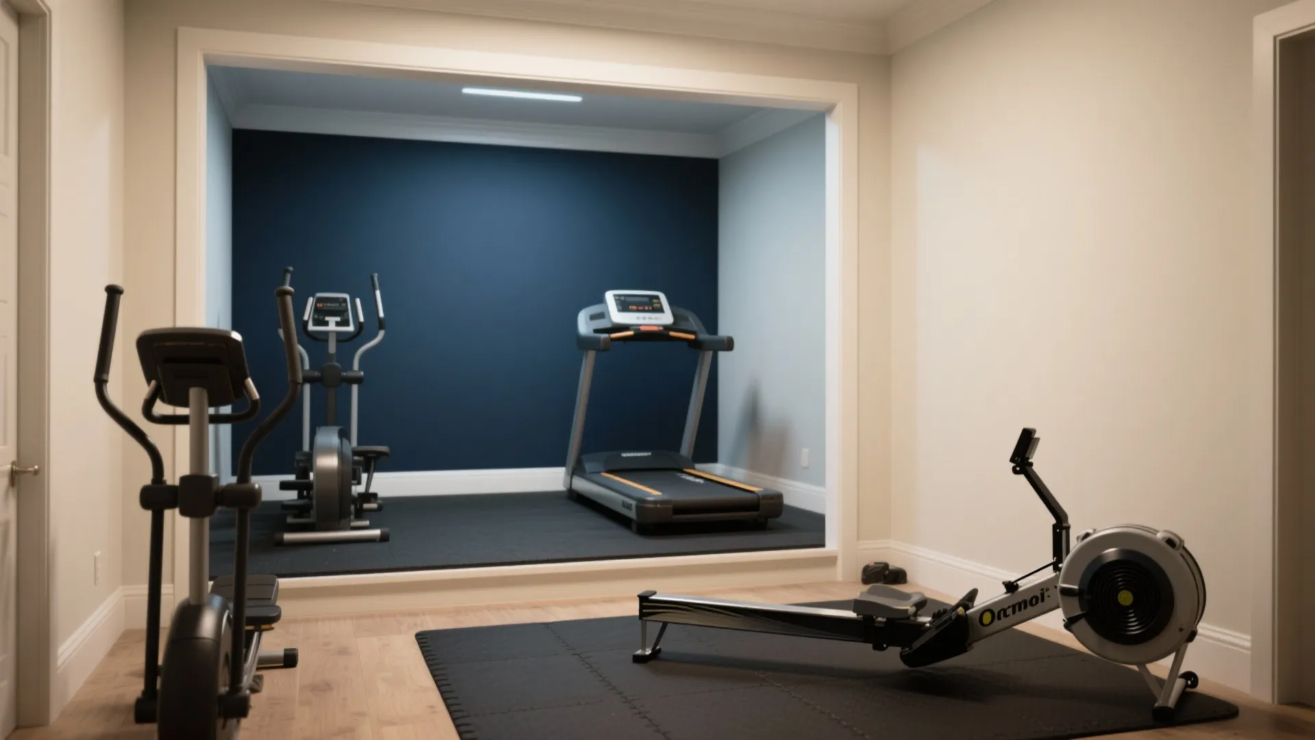 Home gym with navy blue accent wall featuring treadmill rowing machine elliptical and black rubber flooring