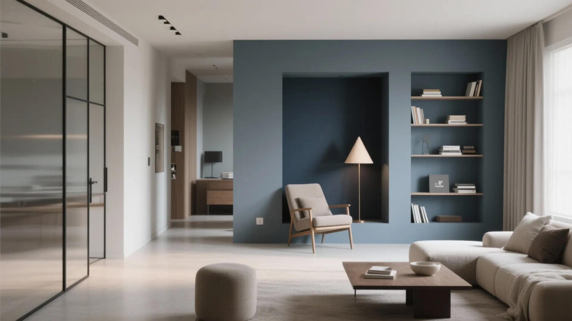 Modern living room with blue accent wall armchair floor lamp bookshelf sofa and coffee table