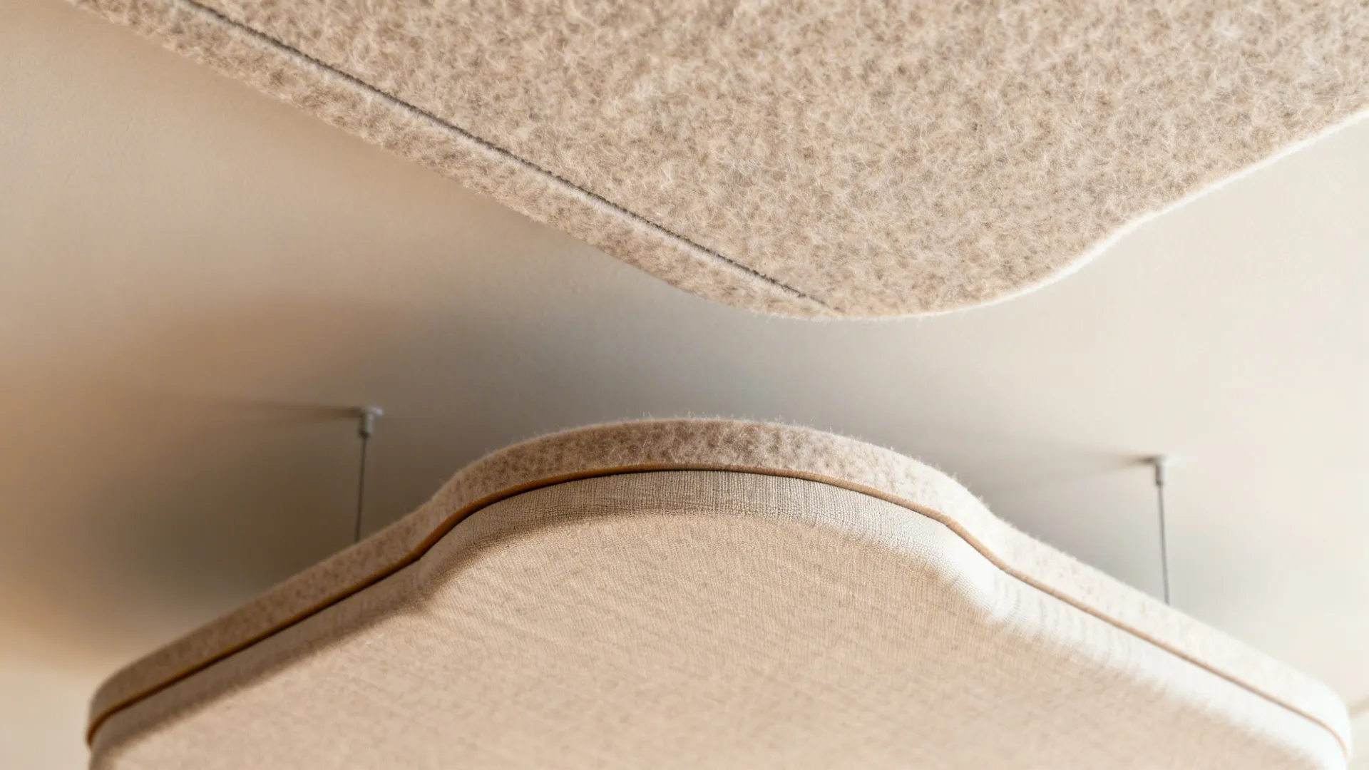 Close-up of PET acoustic panel texture and a fabric cloud’s clean edge and suspension detail.