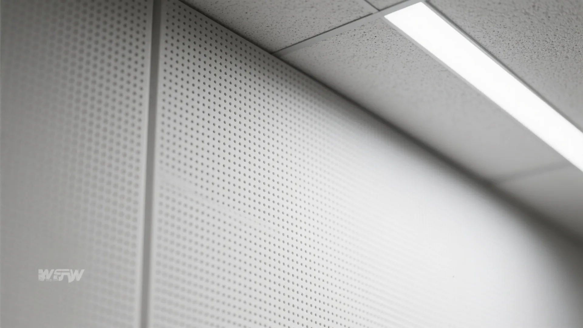 Acoustic panels in a damp-rated grid for spa calm