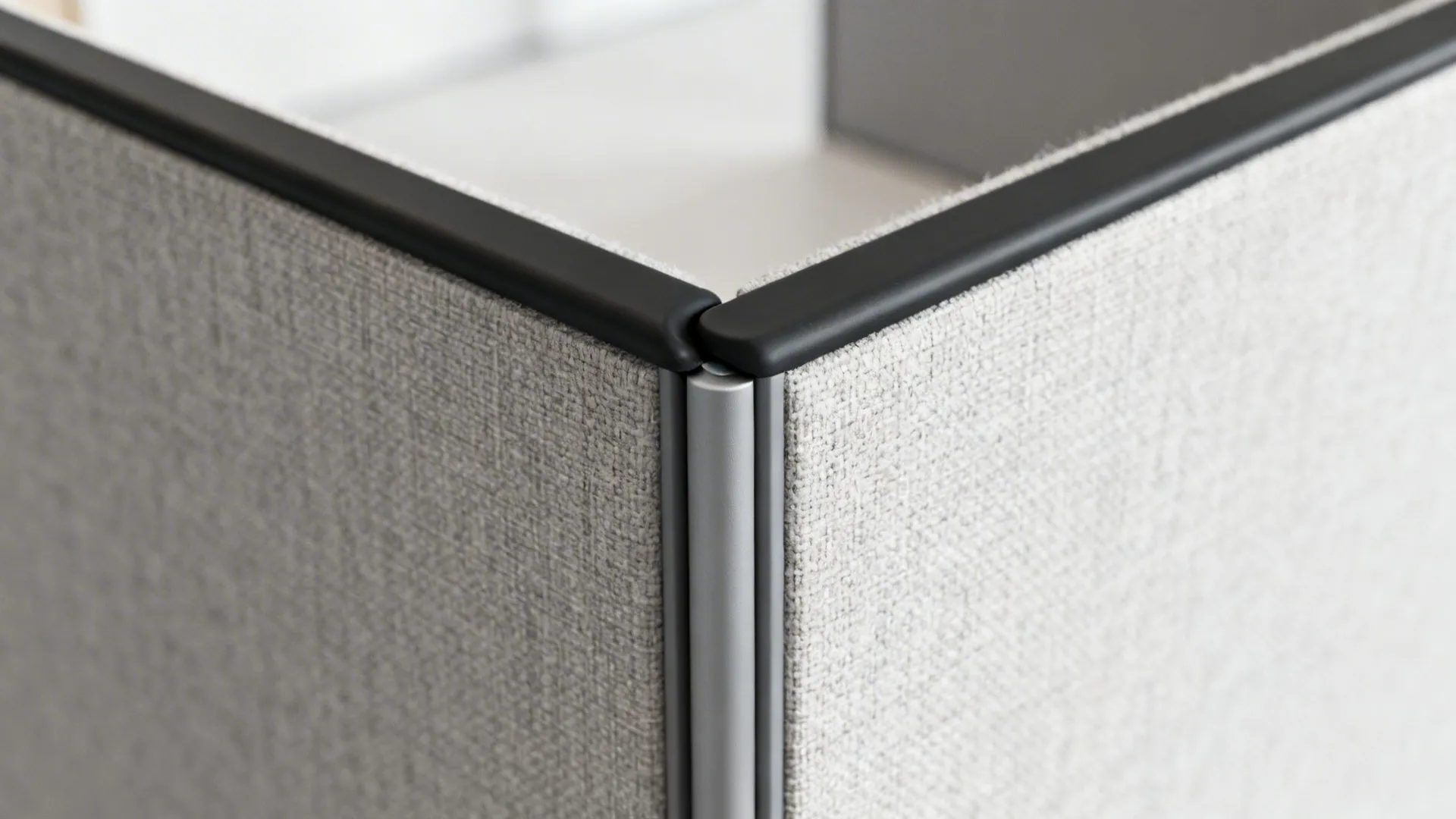 Macro detail of an acoustic seal on a partition edge showing materials and tight joint.