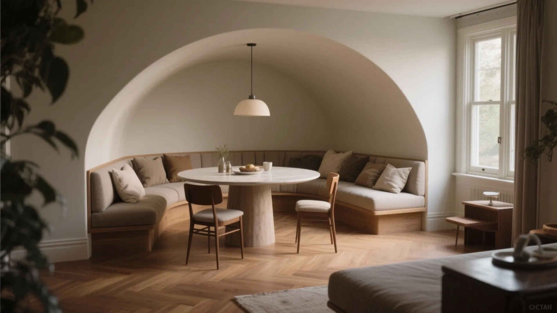 Modern curved wall dining area with round marble table wood chairs sofa and ceiling light
