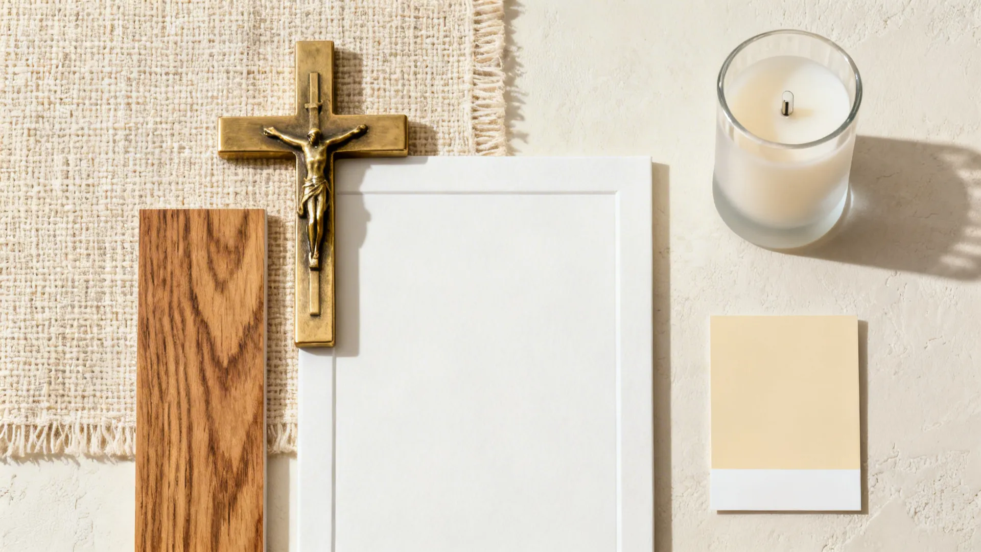 Flat lay of linen, brass, oak, mat board, and warm paint chip for an altar wall.