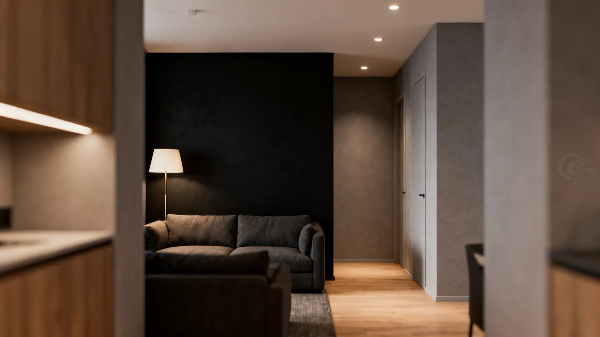 Compact lounge with a single matte black feature wall behind the sofa and layered lighting.