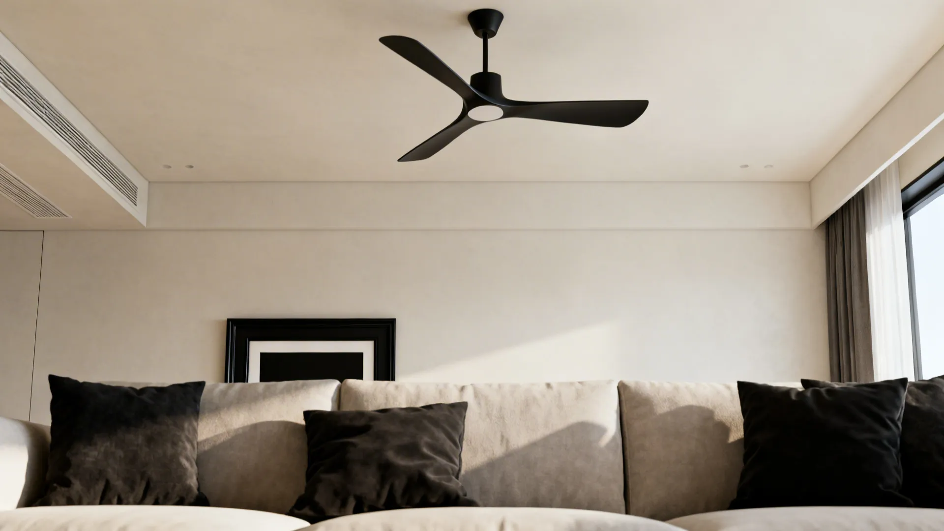 Black ceiling fan as a sculptural focal point on a light ceiling with matching dark accents