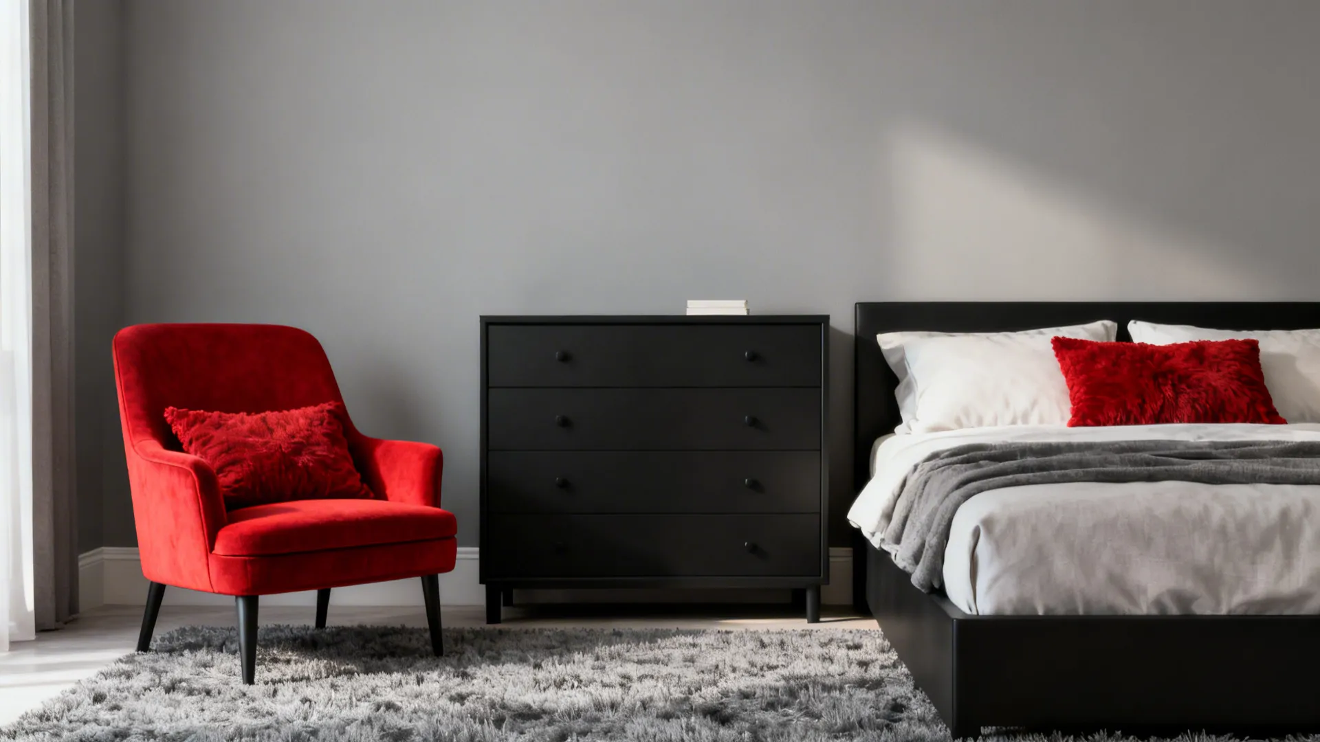 Mid-grey bedroom with black furniture and a red accent chair