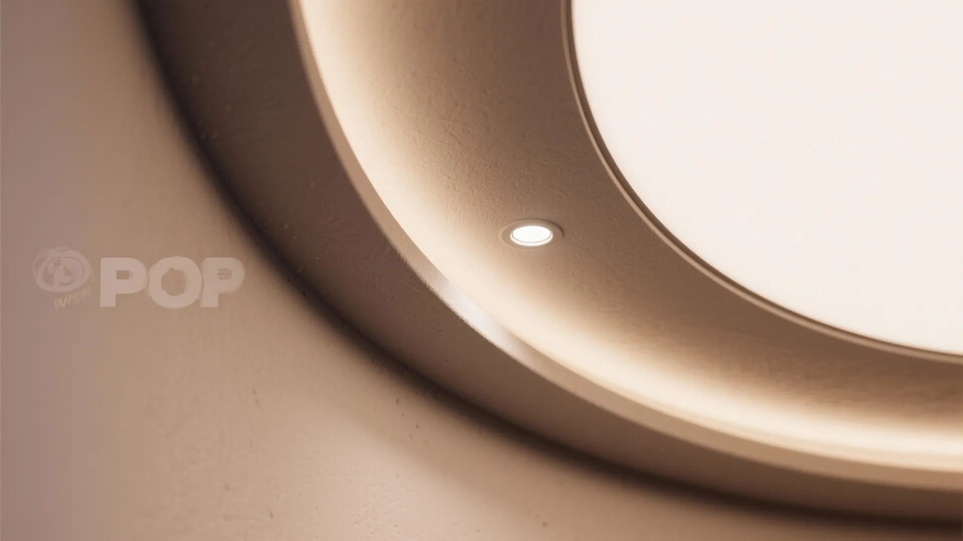 Close-up of a POP arc ceiling curve with an aligned recessed downlight.