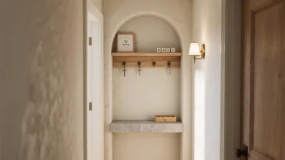 Cozy Entryway Niche with Wooden Hooks and Stone Shelf