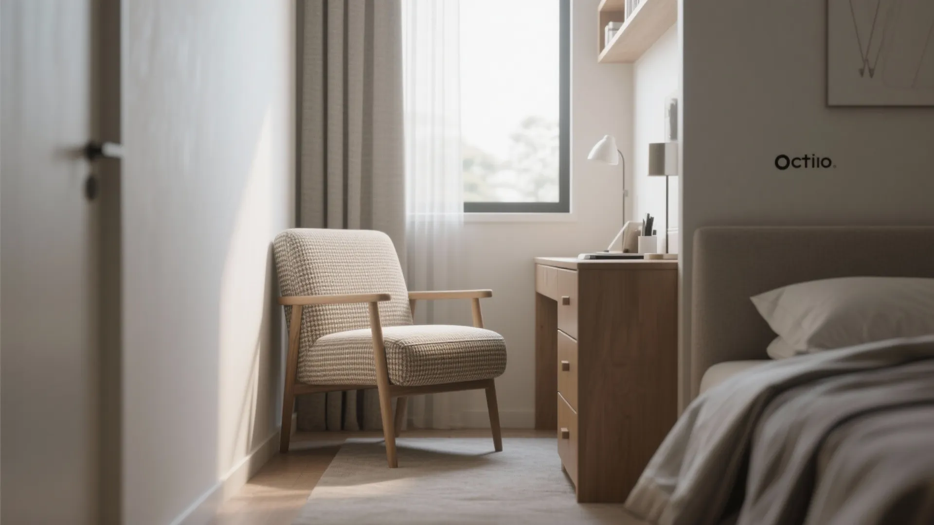 Compact armless accent chair tucked beside a small desk in a narrow bedroom