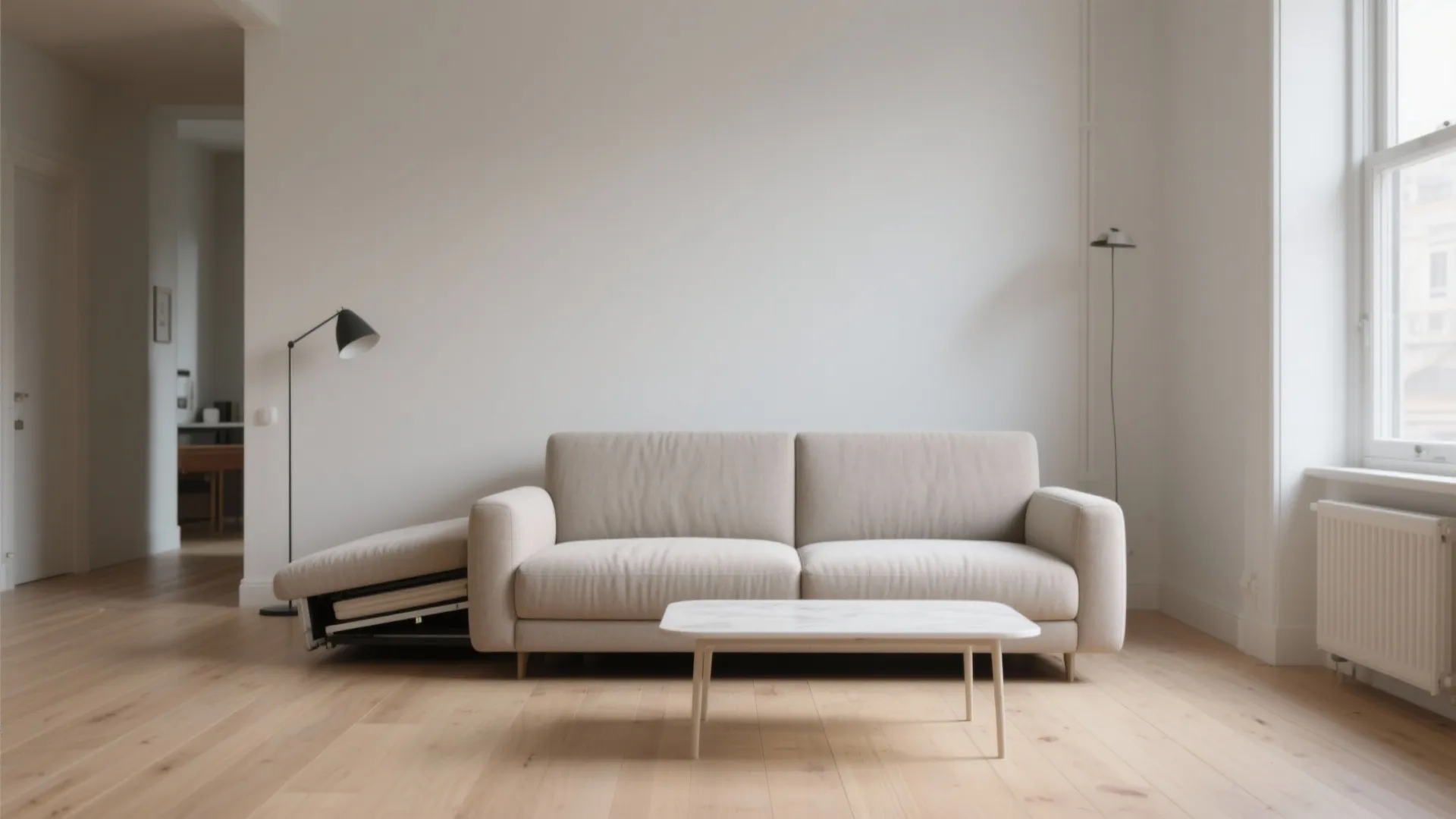 Minimalist living room with beige sofa white marble coffee table wooden floor and tall floor lamp
