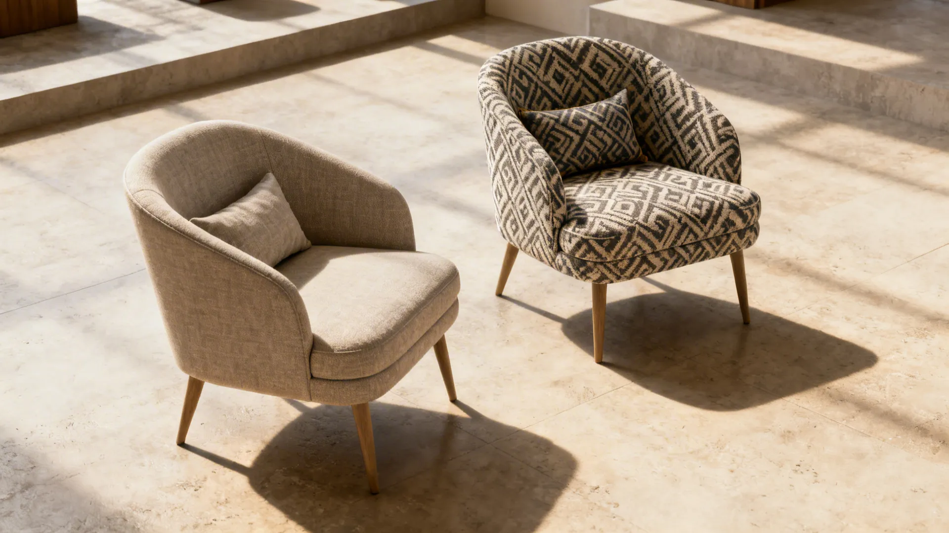 Pair of armless slipper chairs in contrasting fabrics defining zones in an open-plan space