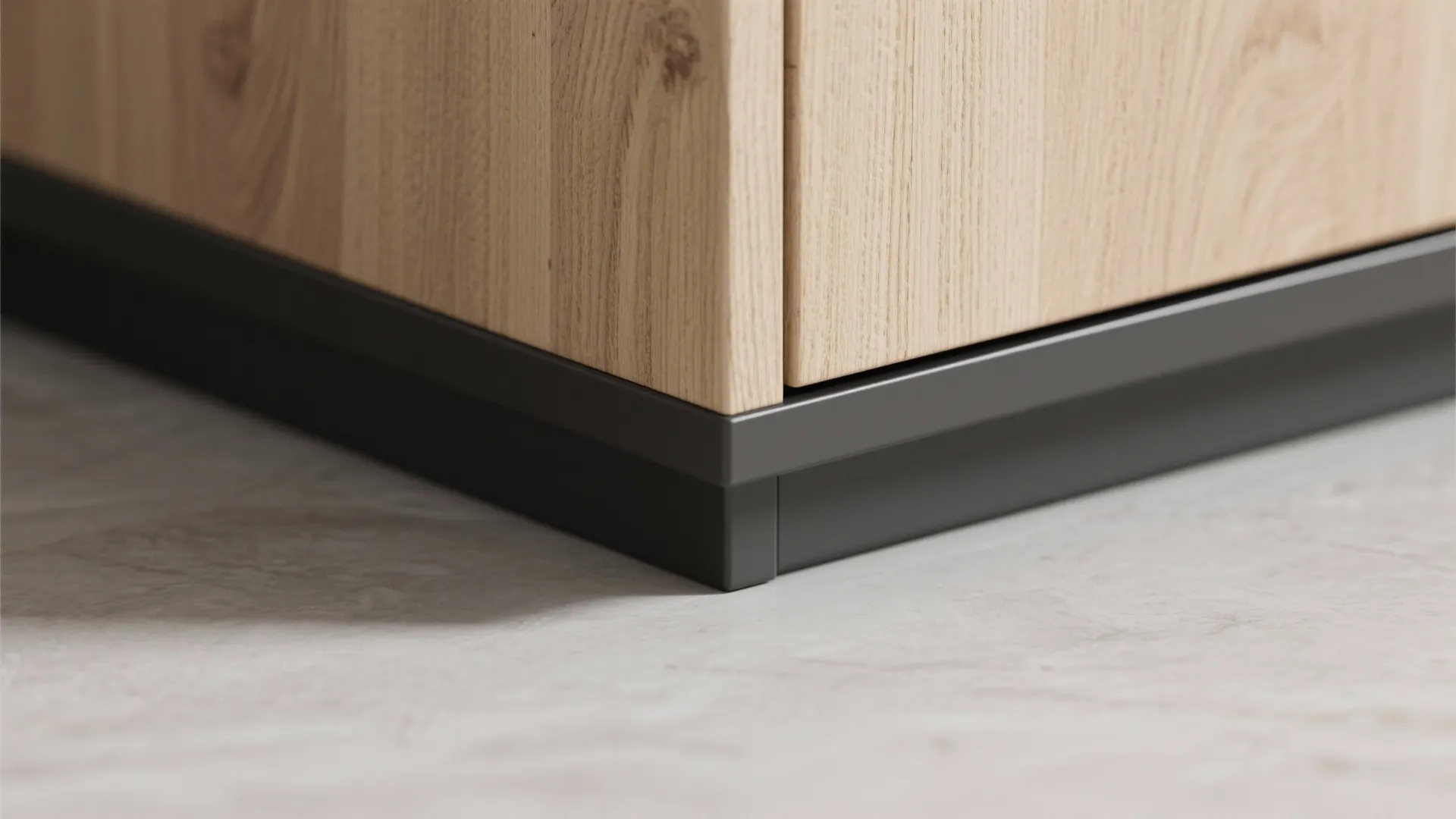 Close up view of a light wood furniture corner with a dark grey metal base