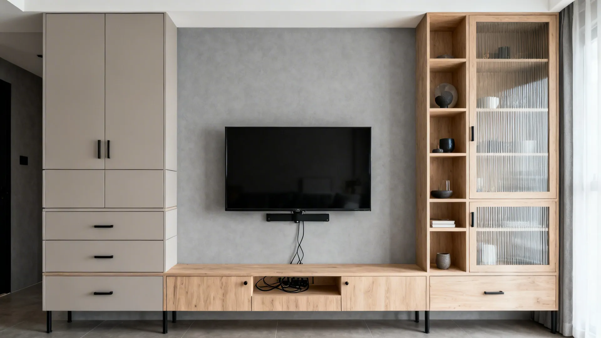 Offset TV wall with tall closed cabinets and open shelves in a modern living room.