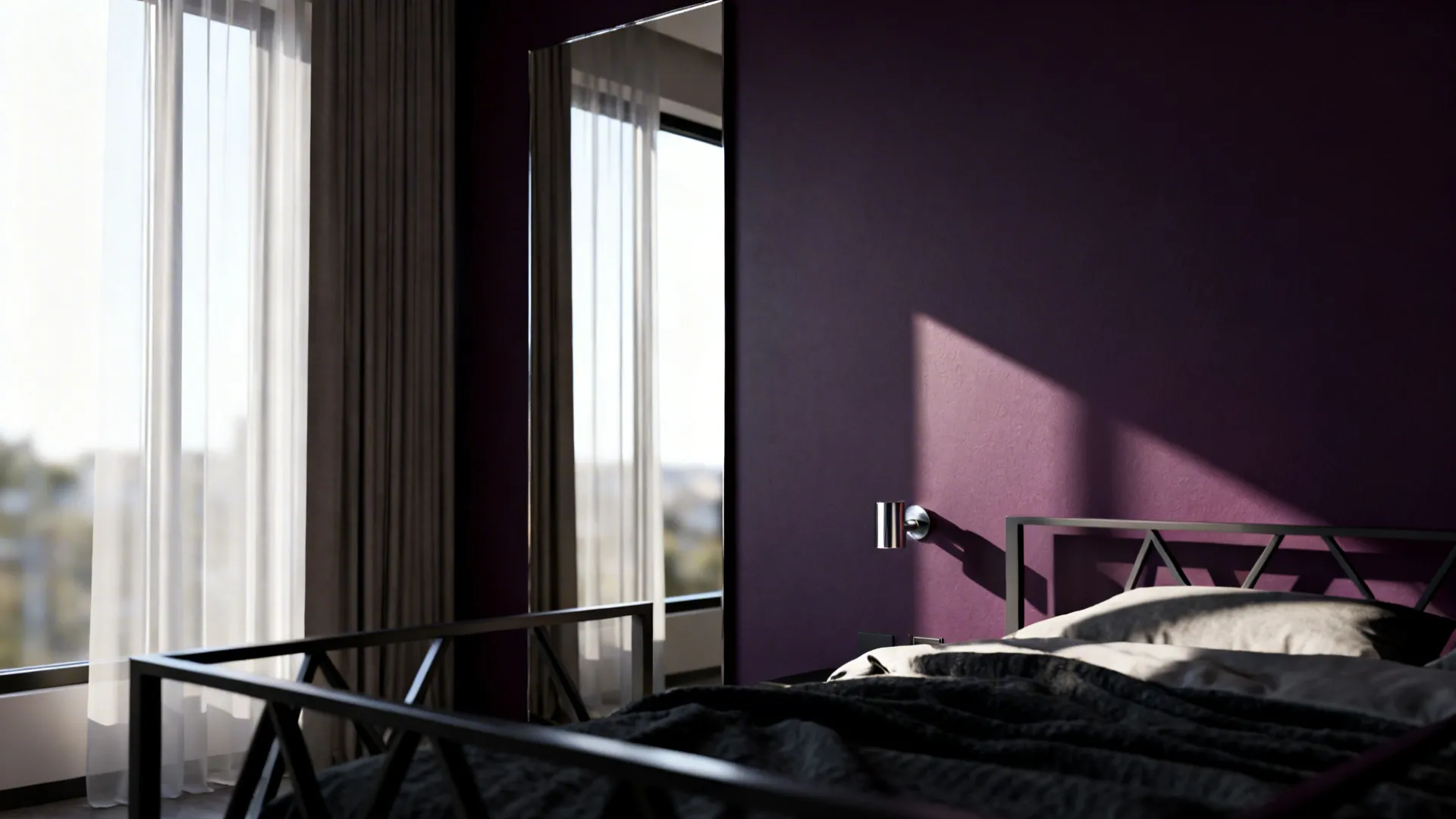 Bedroom with a deep aubergine accent wall and a large mirror reflecting daylight to enlarge the space.