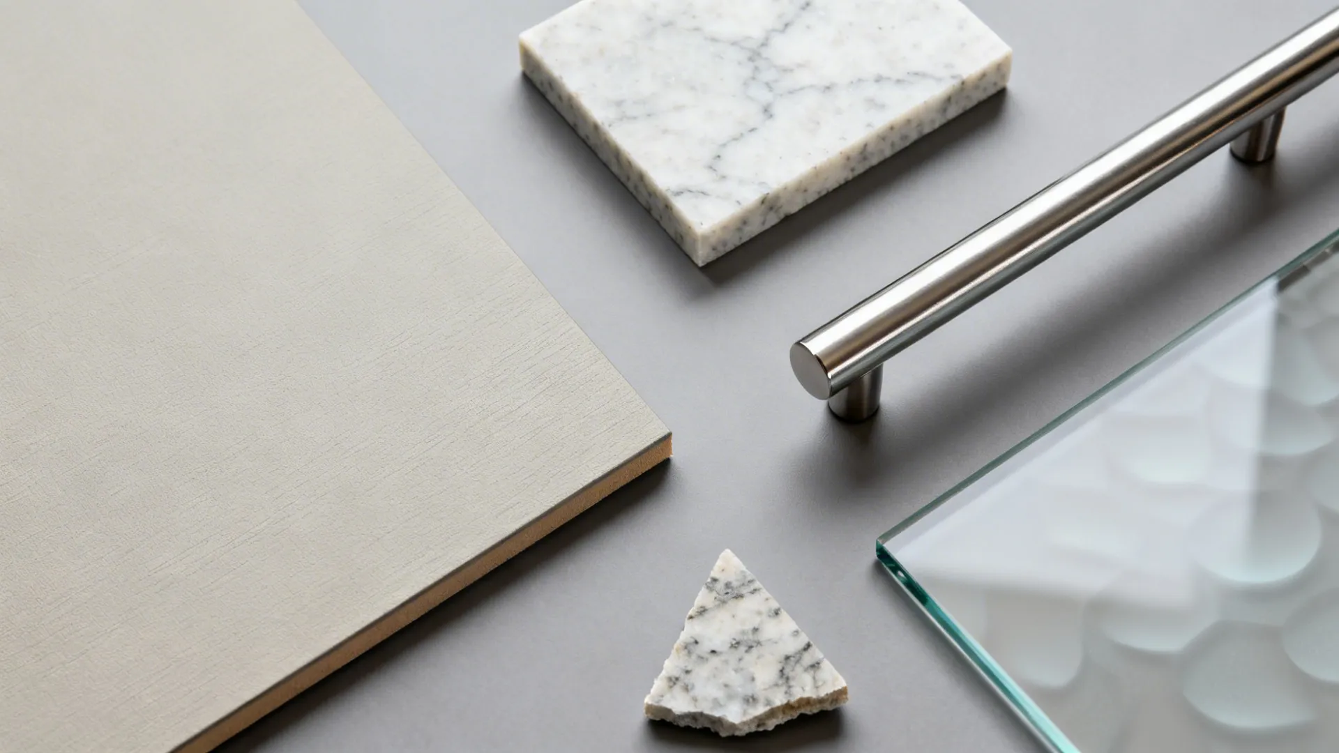 Top-down materials: low-iron glass, matte laminate, quartz, and brushed stainless.