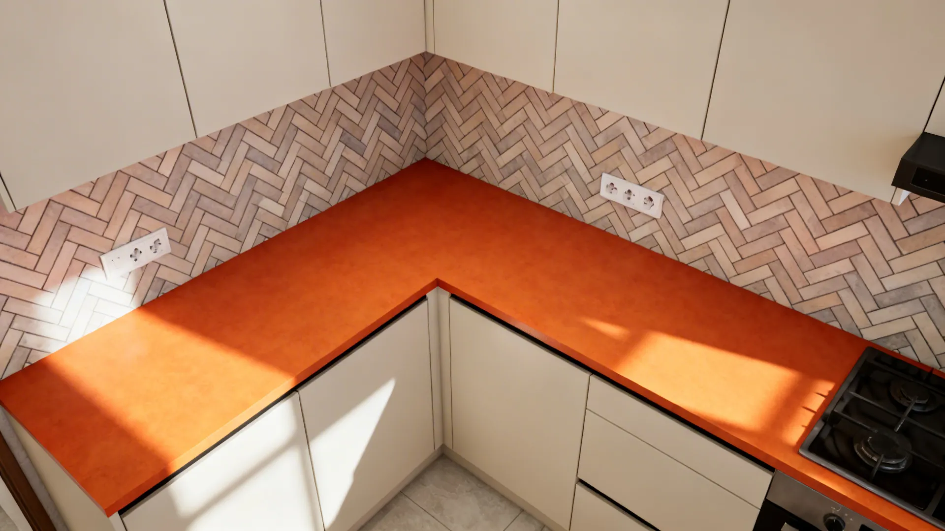 Top-down plan showing orange counter with a white herringbone backsplash layout around outlets.