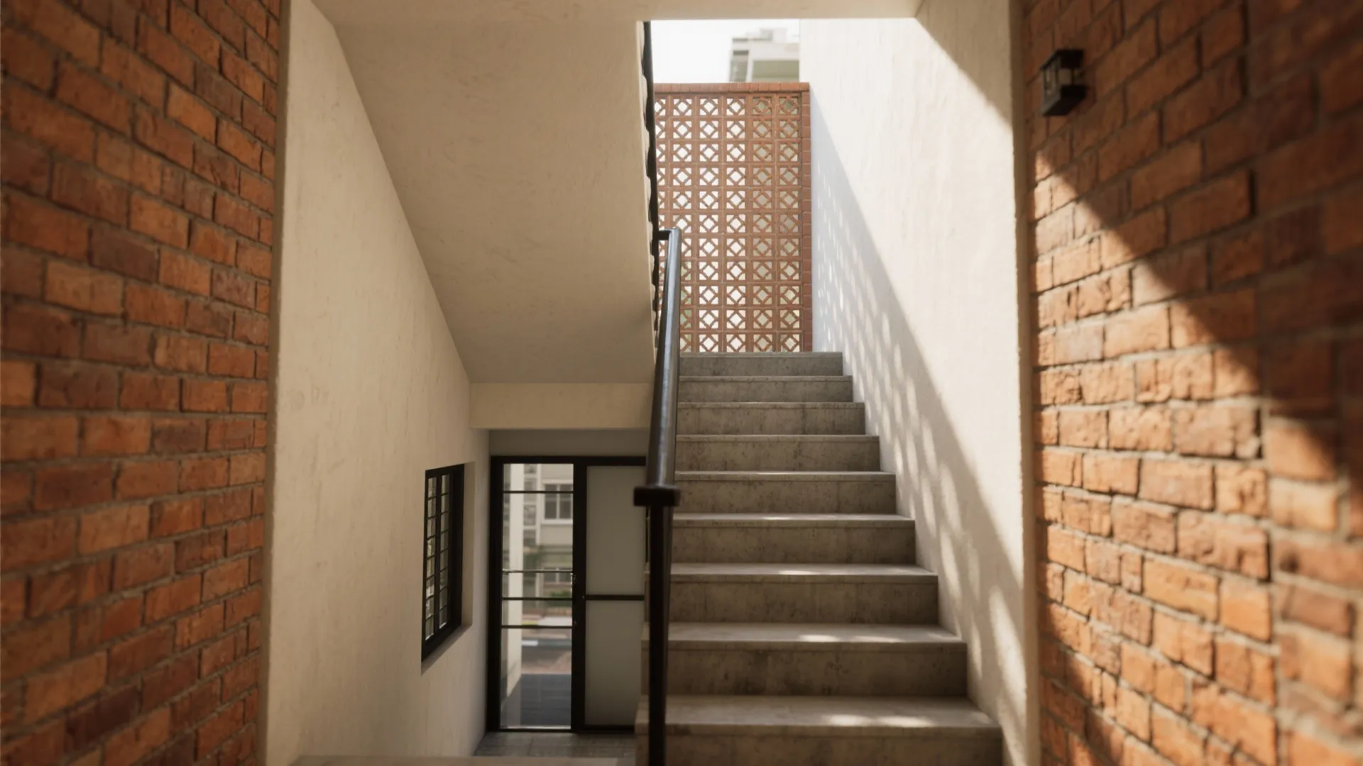 Modern stone staircase with black handrail leading to a red brick wall and natural light