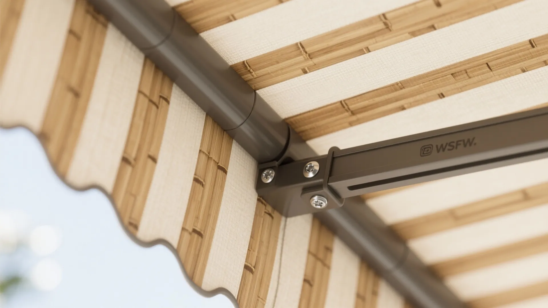 Close up view of a striped outdoor curtain attached to a brown metal support frame