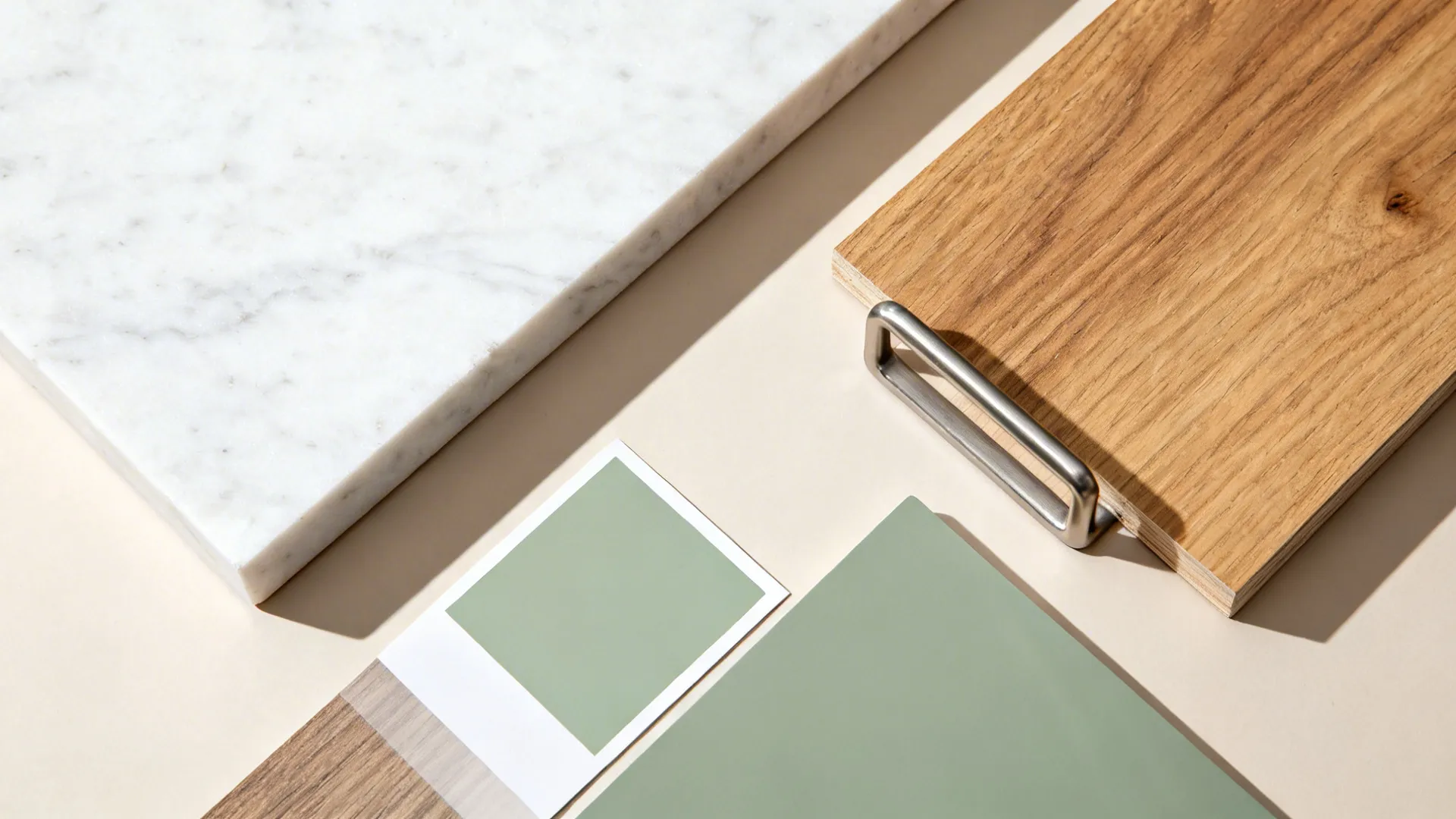 Flat lay of quartz, oak, laminate, and steel bracket materials for a breakfast bar