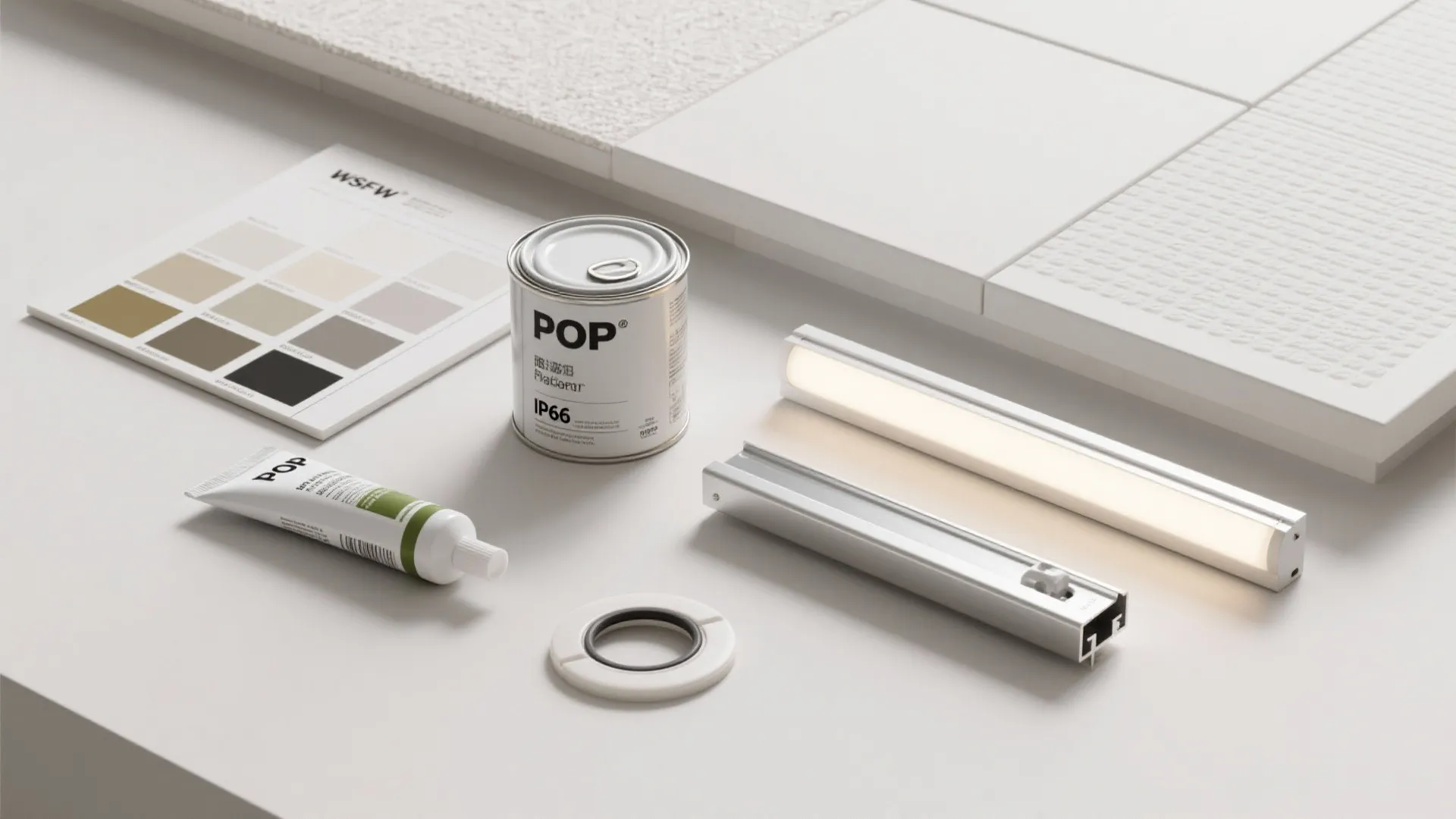 Home renovation materials showing paint can and color samples and modern light fixture on surface