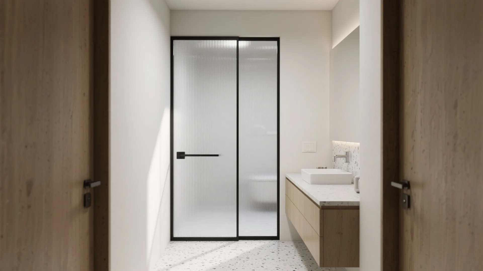 Modern bathroom view through wooden doors featuring frosted glass sliding door and light wood floating cabinet