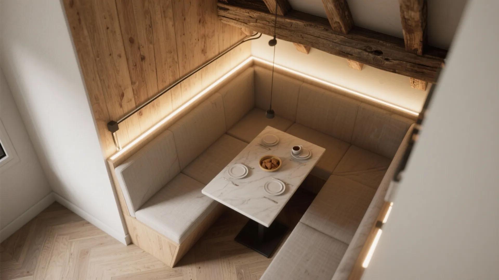 Top-down view of a breakfast nook with integrated lighting inside a reclaimed wooden beam.
