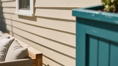 Cozy Outdoor Nook with Wood Siding and Teal Accent