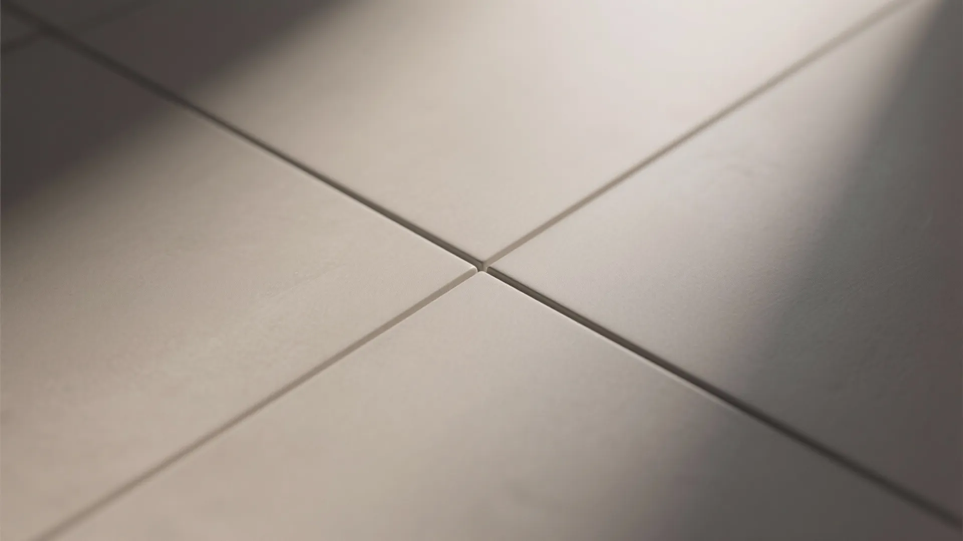 Large floor tiles with clean grout lines and smooth surface in a close up shot now