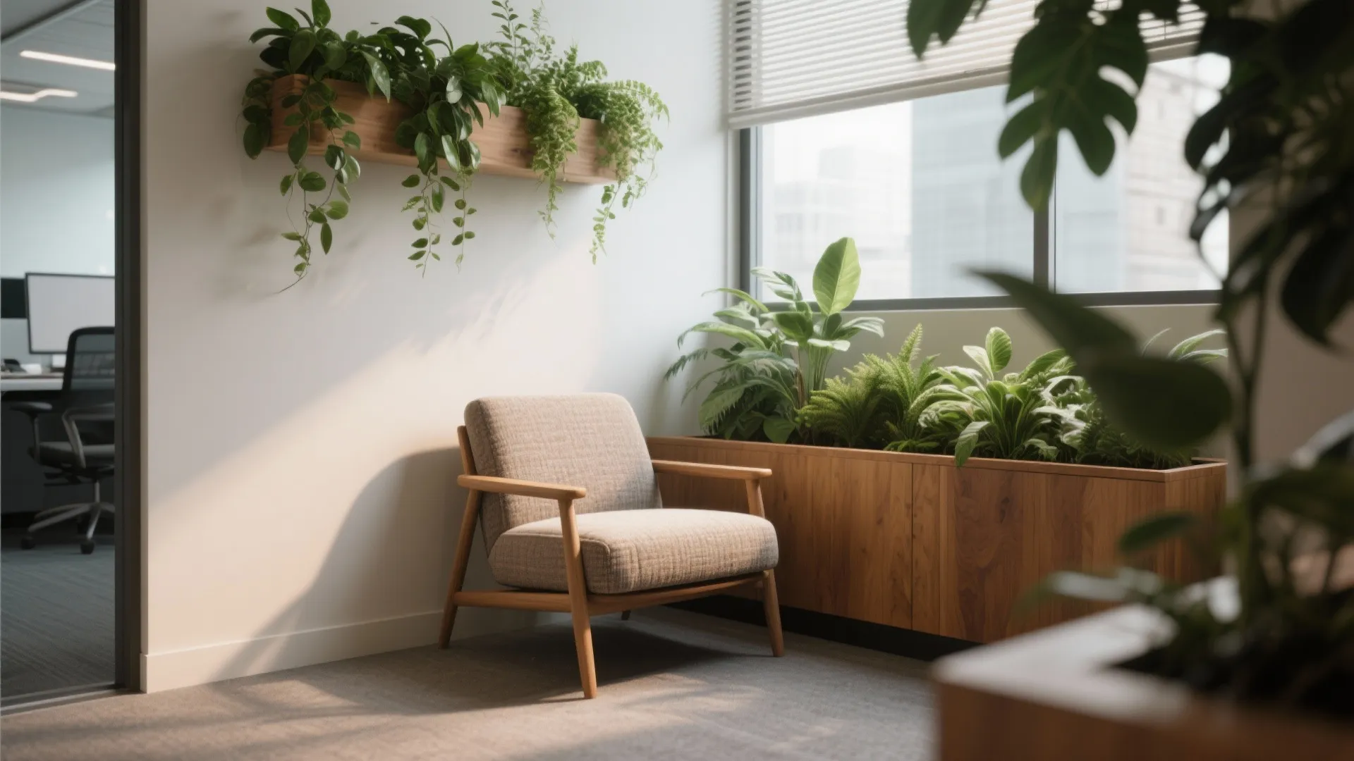 Office corner with a comfortable grey chair wooden wall plants and a large bright window