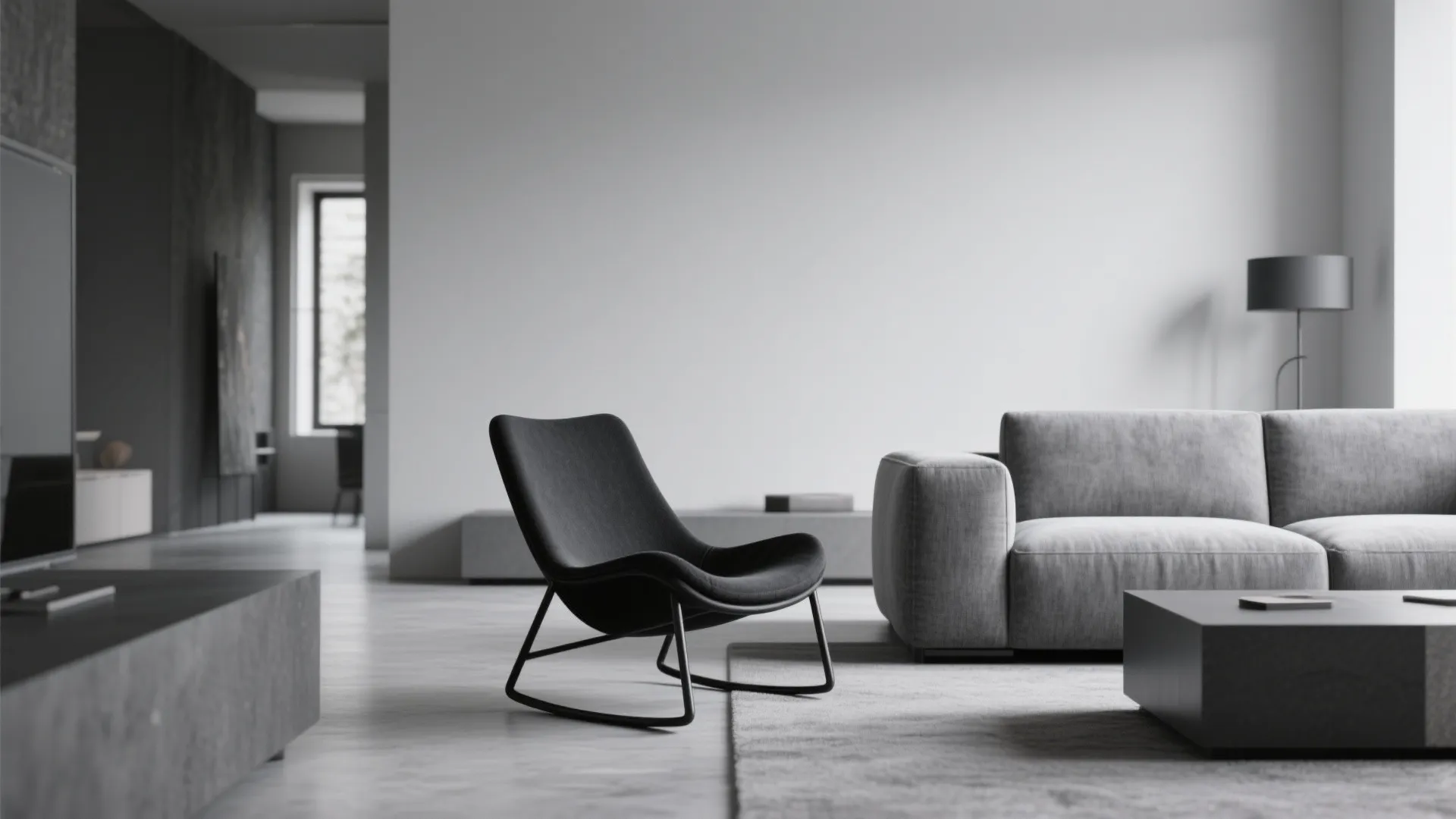 Modern living room with black rocking chair grey sofa wooden floor and large white wall