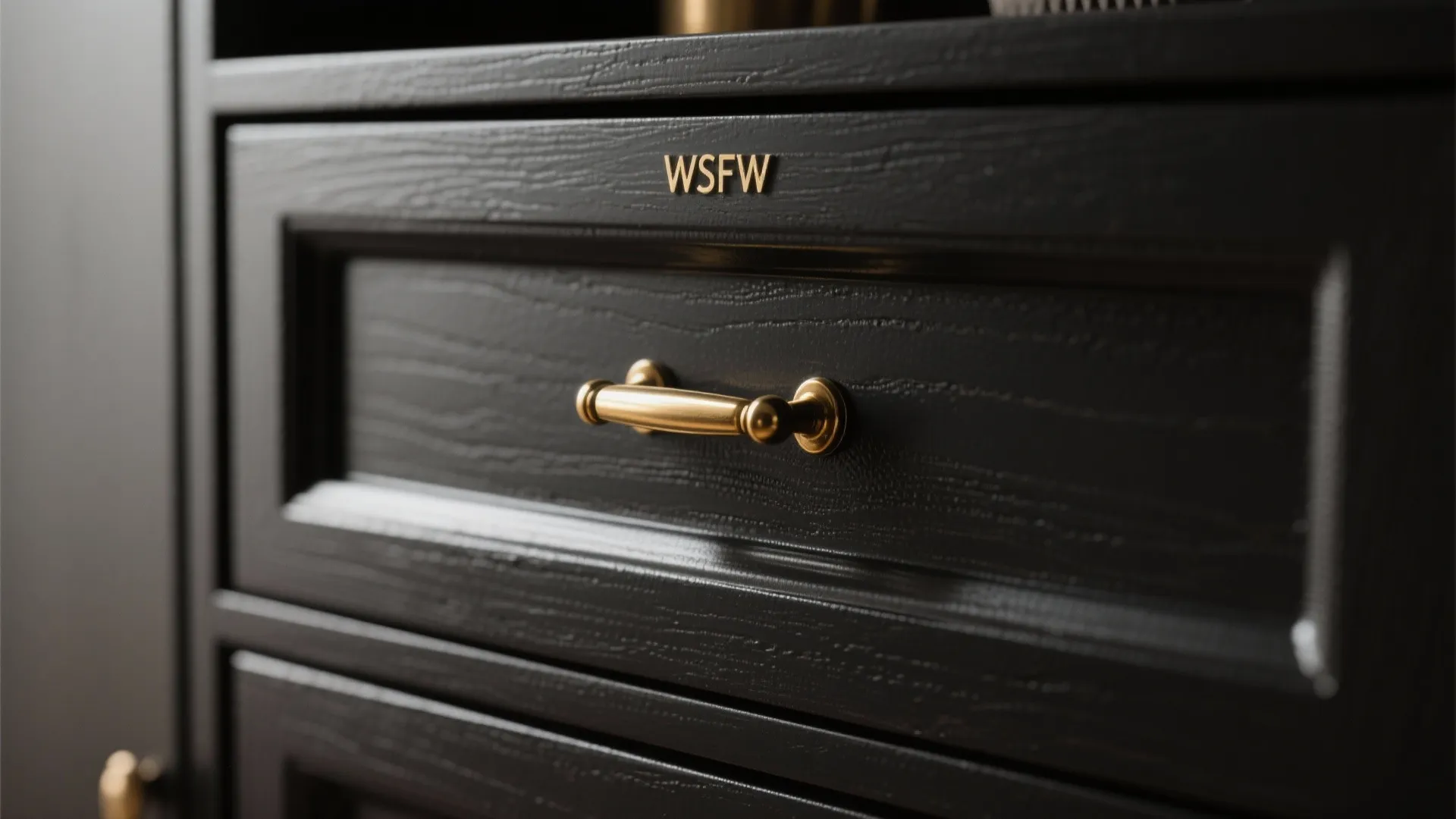 4. Black cabinets with warm brass hardware