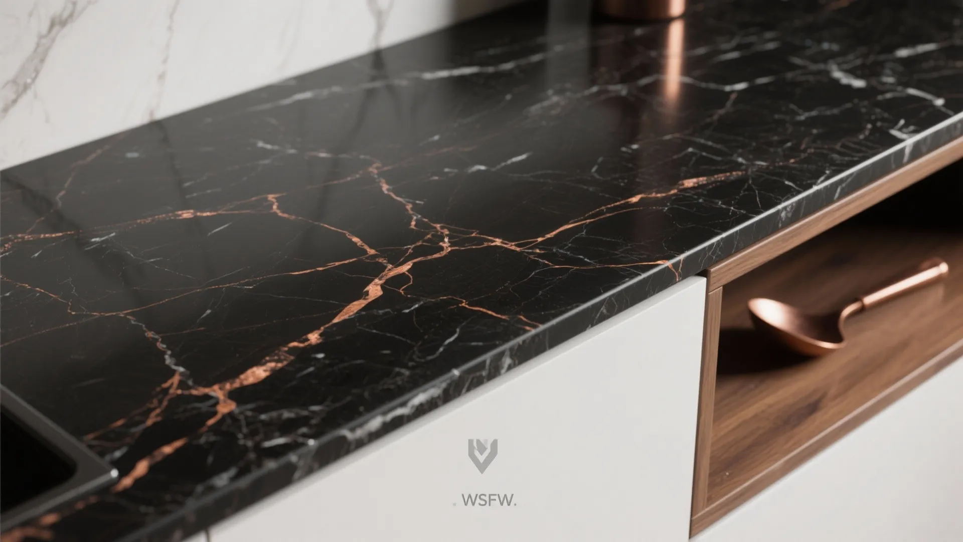 Black marble kitchen countertop with copper veins above white cabinets and a small wooden shelf