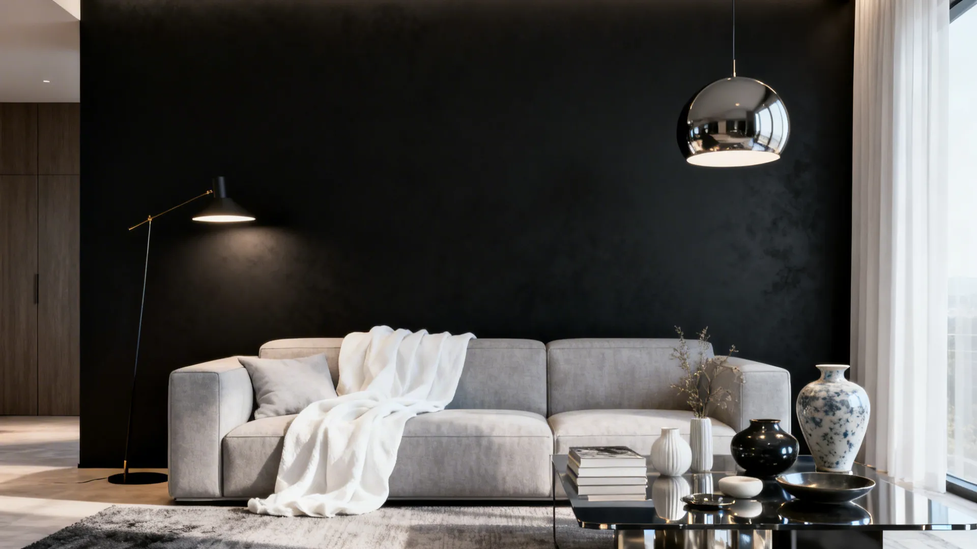 Living room with a matte black feature wall balanced by soft white and light-grey furnishings