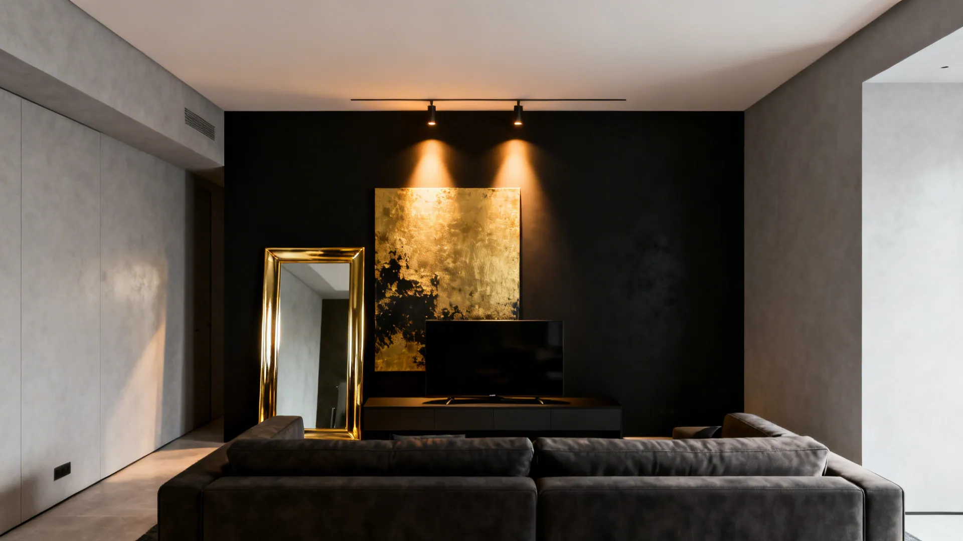 Living area with a matte black feature wall and gold-accented artwork