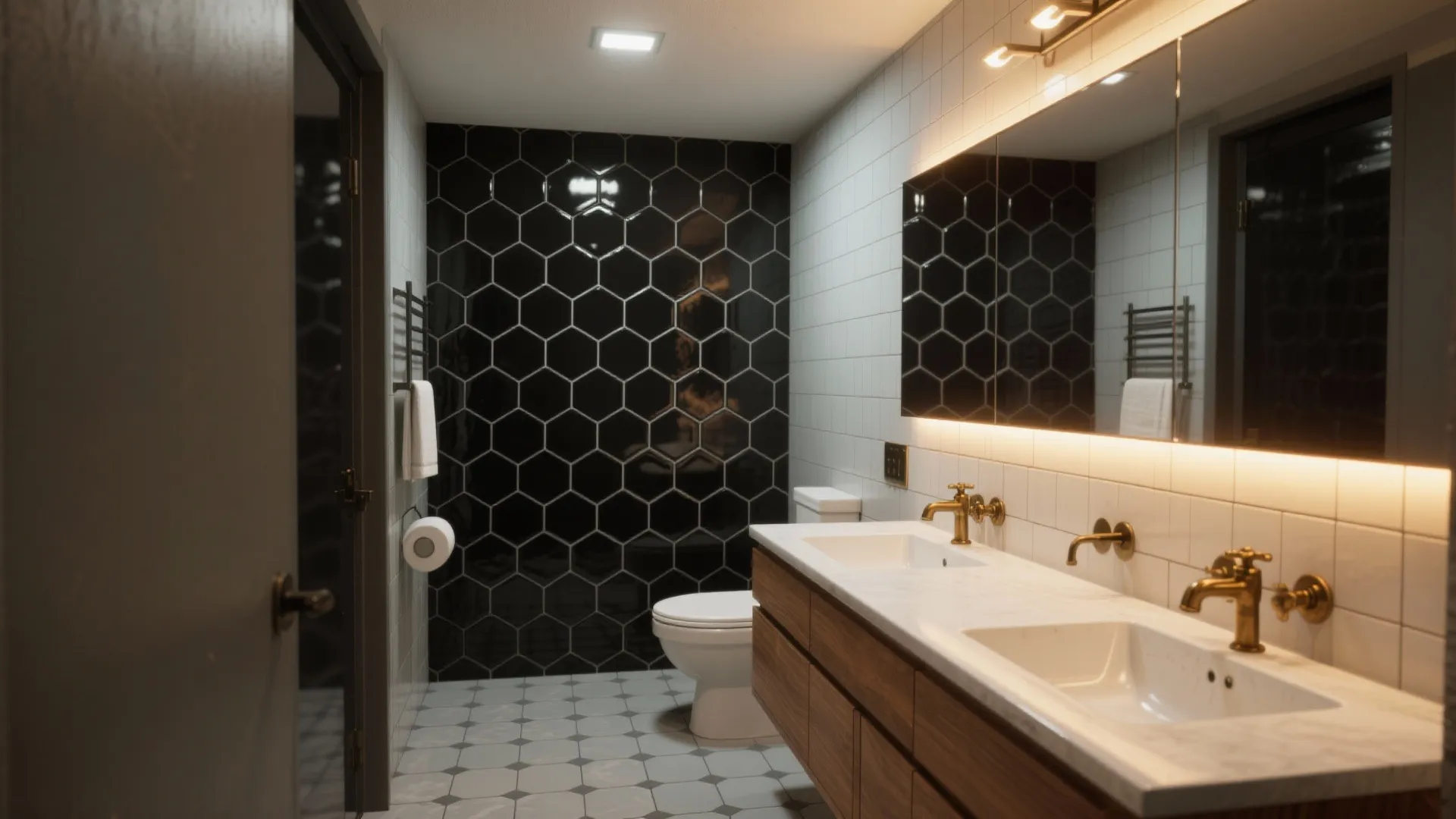 Bathroom with black hexagon wall tiles a wood cabinet with two sinks and gold faucets