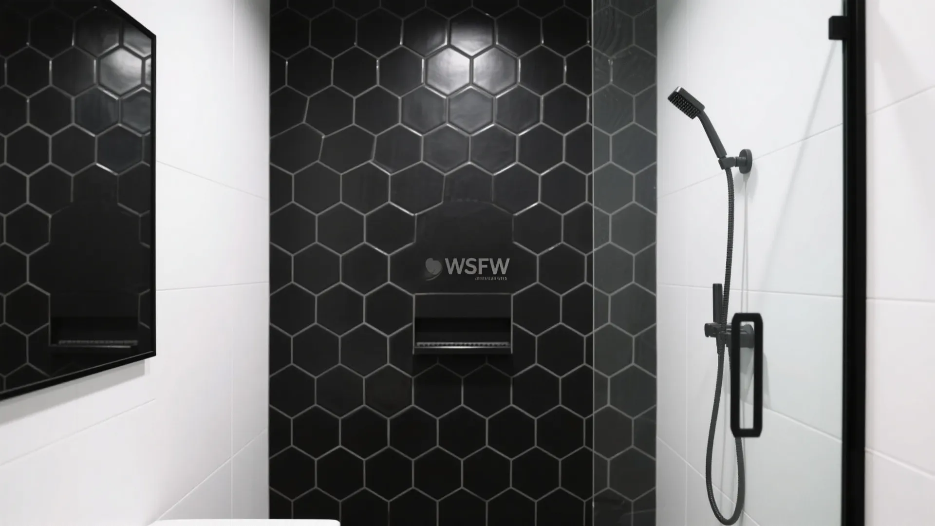 Shower area with black hexagon wall tiles white side walls and a black shower head