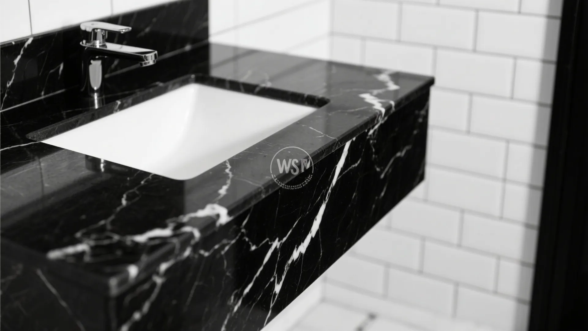 Macro detail of black marble vanity top with white veining