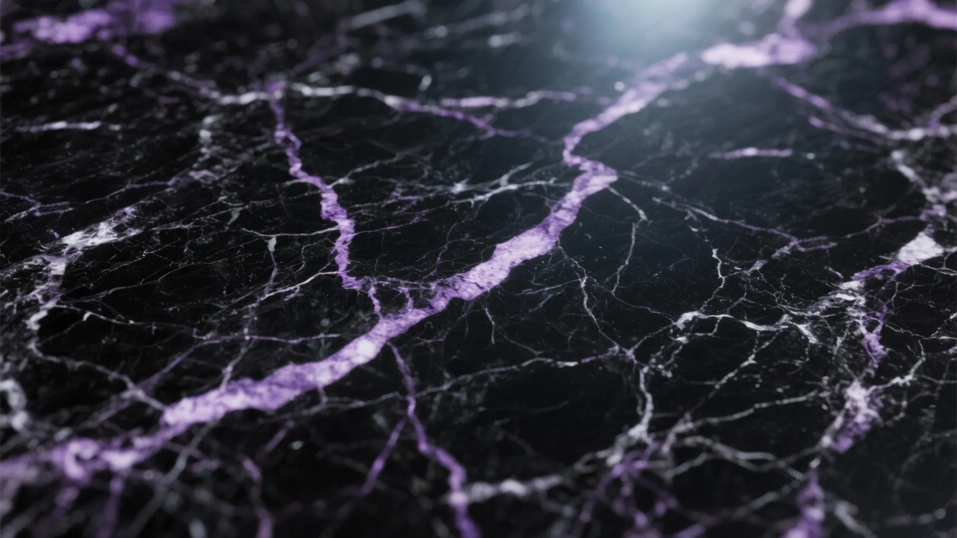 Close up view of black marble surface with purple veins and glossy finish under light