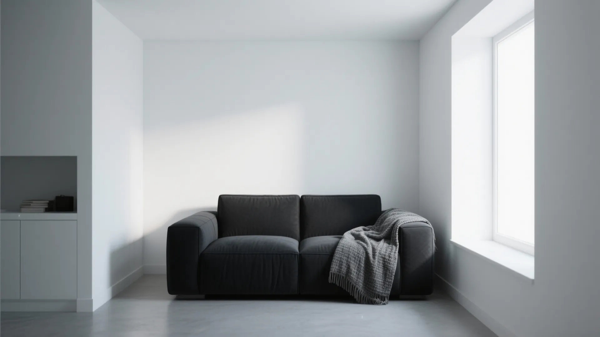 1. Minimalist Black Sofa with White Walls