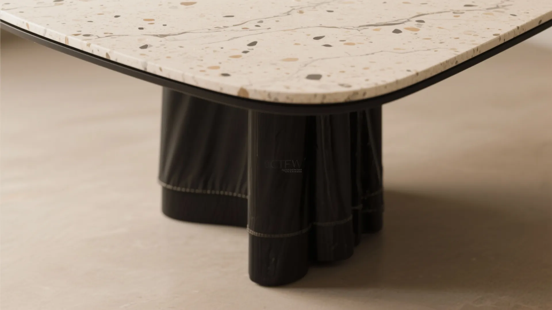 3. Black table with a stone or light-colored top