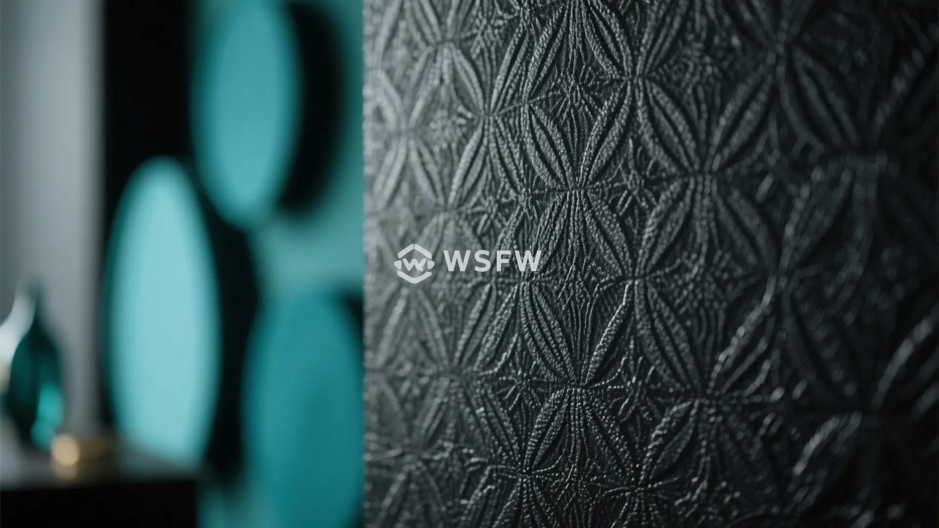 Close up of black textured wallpaper with circular patterns on a wall in a modern room