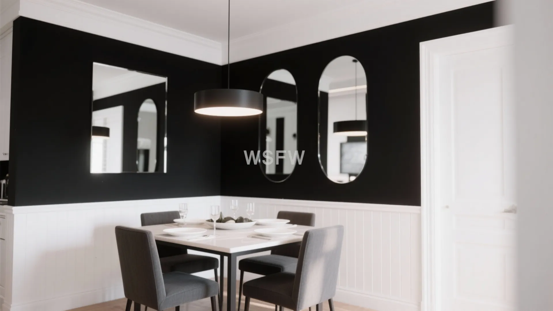 Modern dining space with black walls white wall panels white table grey chairs and mirrors